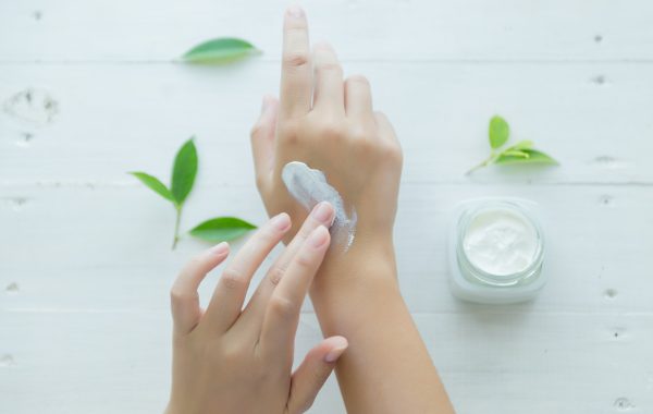 woman holds a jar with a cosmetic cream in her hands. skin care